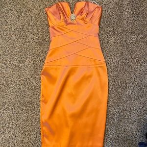 Orange strapless tight fitting midi dress